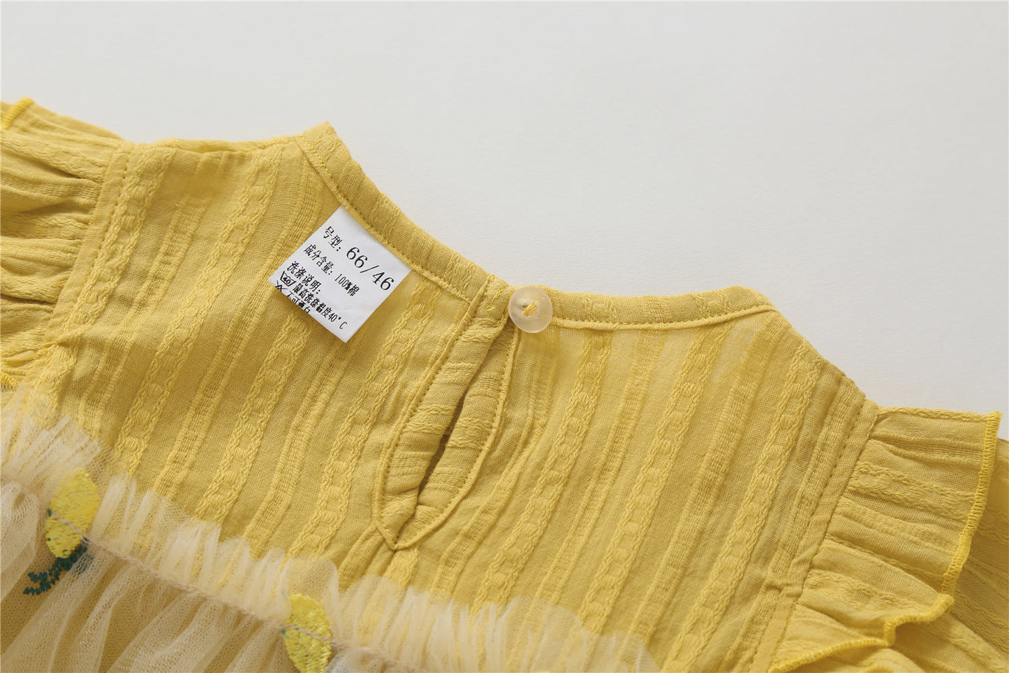 Embroidered Mesh Overlay Flounce Onesie