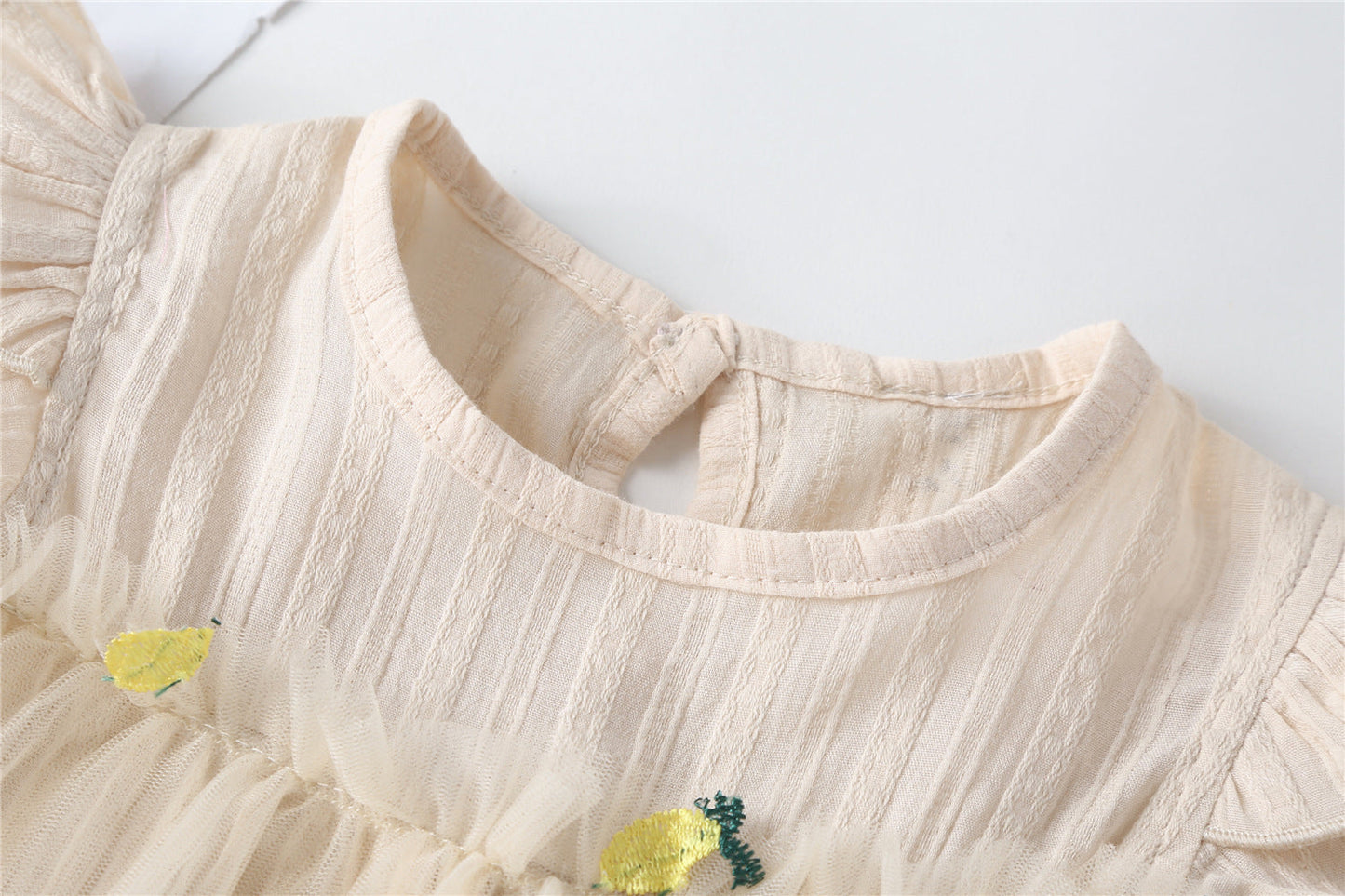 Embroidered Mesh Overlay Flounce Onesie