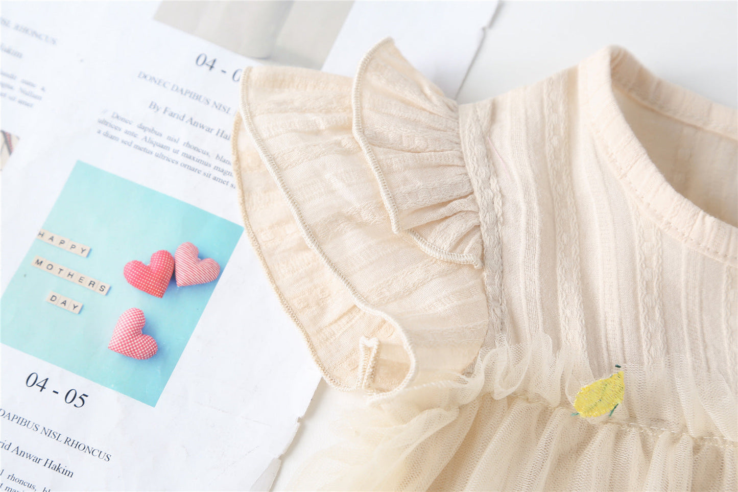 Embroidered Mesh Overlay Flounce Onesie
